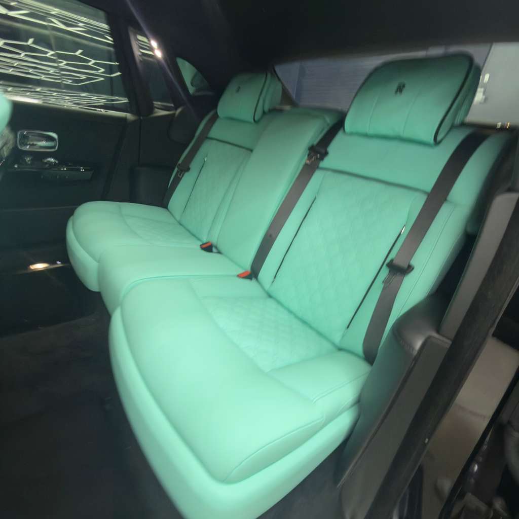 Stitched red leather luxury car cabin fully detailed by Motiv Auto in Pompano Beach