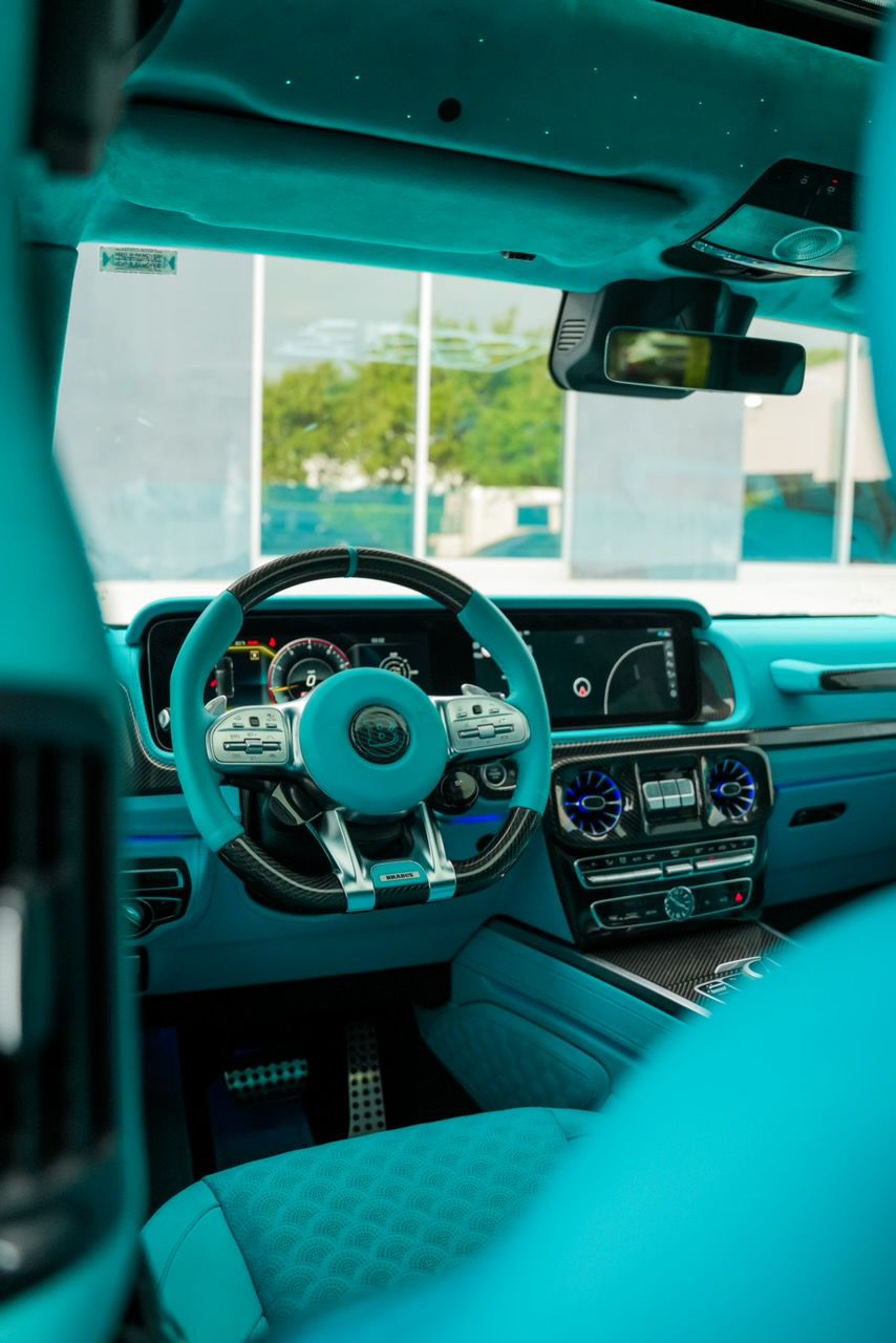Luxury beige leather and alcantara high-end car cabin fully restored by Motiv Auto in Pompano Beach