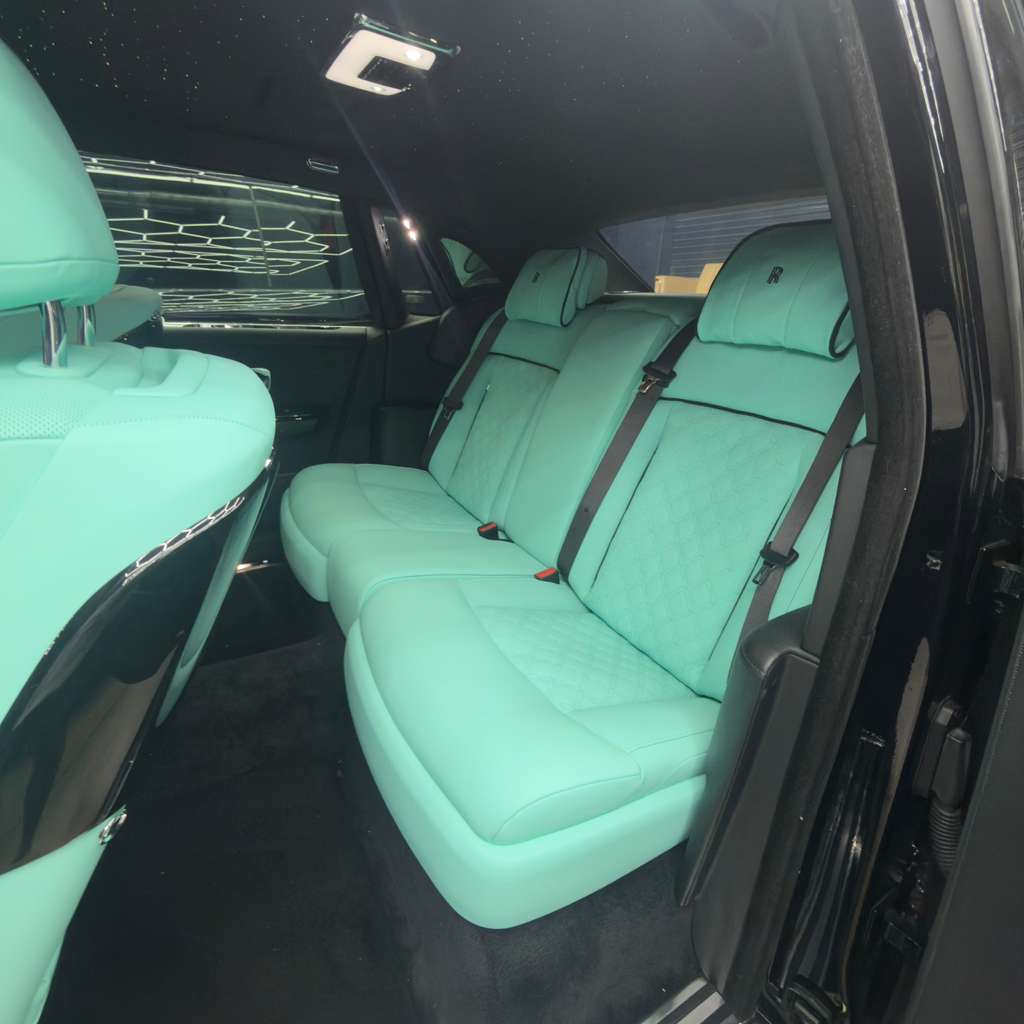 High-end stitched red leather luxury car seats after professional upholstery detailing Pompano Beach