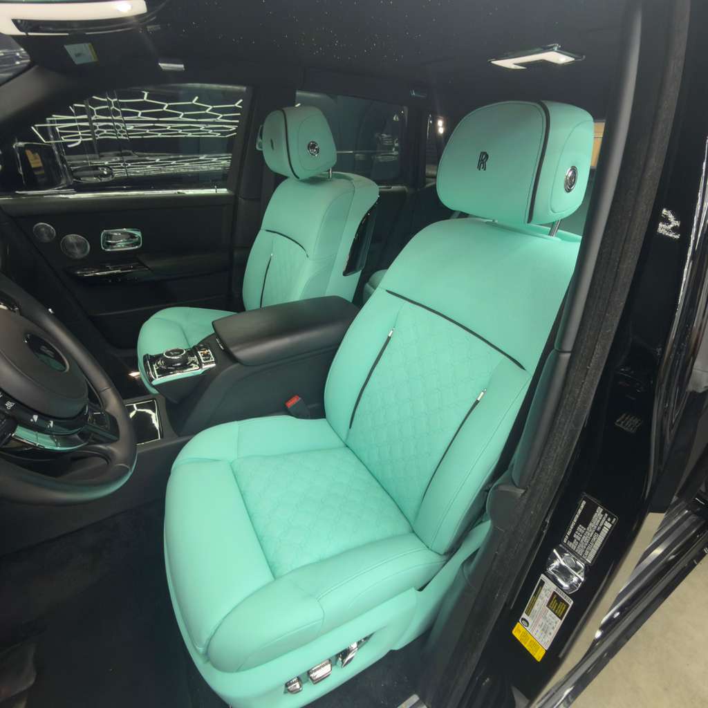 High-end stitched red leather luxury car seats with stubborn stains professionally removed in Pompano Beach